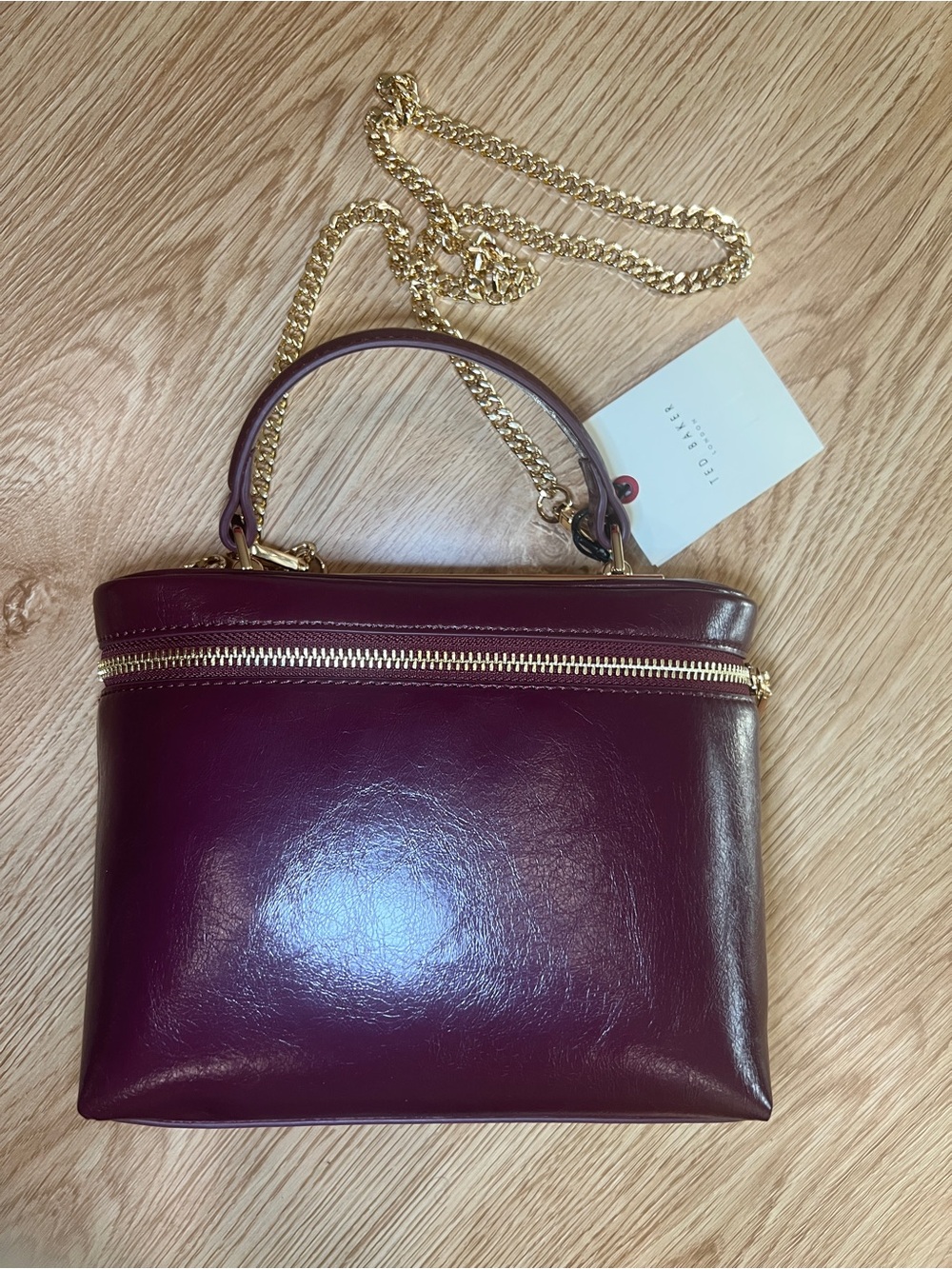 Ted Baker TIA
Mini Zip Top Handle Bag burgundy with gold crossbody
